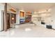 Large living room with custom media center, built-in bench seating and recessed lighting at 10707 E Cottontail Ln, Scottsdale, AZ 85255