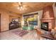 Inviting living room features a cozy fireplace, large window, and tile flooring at 10707 E Cottontail Ln, Scottsdale, AZ 85255