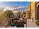 Outdoor seating area with a view of the pool and desert landscape, ideal for relaxation and entertaining at 10707 E Cottontail Ln, Scottsdale, AZ 85255