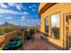 Patio with seating area and views of surrounding hills and clear skies at 10707 E Cottontail Ln, Scottsdale, AZ 85255