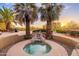 Relaxing spa area with desert views, featuring rock features and comfortable seating, perfect for unwinding and enjoying the scenery at 10707 E Cottontail Ln, Scottsdale, AZ 85255