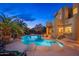 Backyard swimming pool and adjacent outdoor living space with desert and mountain views at 10707 E Cottontail Ln, Scottsdale, AZ 85255