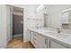 Bathroom featuring double sinks with modern fixtures, vanity cabinet, and glass shower at 11260 N 92Nd St # 1014, Scottsdale, AZ 85260