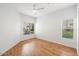 Bright bedroom featuring sleek ceiling fan, and two windows providing natural light at 11260 N 92Nd St # 1014, Scottsdale, AZ 85260