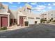 Two-story townhome with two-car garage and landscaped entrance provides a welcoming curb appeal at 11260 N 92Nd St # 1014, Scottsdale, AZ 85260