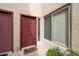 Charming entryway features a bright red door, a window, and a welcoming 'hello' door mat at 11260 N 92Nd St # 1014, Scottsdale, AZ 85260