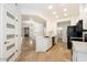 Open-concept kitchen with black appliances and a breakfast bar seamlessly connects to living spaces at 11260 N 92Nd St # 1014, Scottsdale, AZ 85260