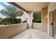 Cozy patio featuring stone floors, stucco walls, and beautiful views of nature at 11260 N 92Nd St # 1014, Scottsdale, AZ 85260