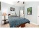 Comfortable bedroom featuring a plush carpet, blue bedding, and soft, natural lighting at 11352 E Starkey Ave, Mesa, AZ 85212