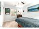 Cozy bedroom features a ceiling fan, neutral carpet, and a window providing natural light at 11352 E Starkey Ave, Mesa, AZ 85212