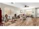 Bright and airy living room with tile flooring and cozy seating at 11352 E Starkey Ave, Mesa, AZ 85212