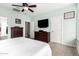 Spacious main bedroom with light blue walls, a ceiling fan, and two matching dressers at 11352 E Starkey Ave, Mesa, AZ 85212