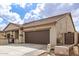 Charming single-story home with a tile roof and a two car garage at 11831 W Daley Ct, Sun City, AZ 85373