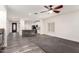 Open-concept floor plan with kitchen island view from the living room at 11831 W Daley Ct, Sun City, AZ 85373