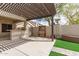 This covered patio features a serving bar and ample space to entertain Gathering and friends at 11831 W Daley Ct, Sun City, AZ 85373