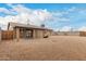 View of the back of the house with large backyard and rock landscaping at 1201 S 80Th St, Mesa, AZ 85209