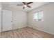 Bright bedroom featuring new laminate flooring, ceiling fan, and natural light at 1201 S 80Th St, Mesa, AZ 85209