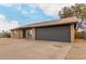 Single-story home with a two-car garage, desert landscaping, and a paved driveway on a sunny day at 1201 S 80Th St, Mesa, AZ 85209