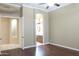 Bedroom featuring wood floors with ensuite bathroom at 13487 E Gold Dust Ave, Scottsdale, AZ 85259