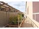 The garden features raised beds with a grape arbor on a gravel path at 13487 E Gold Dust Ave, Scottsdale, AZ 85259