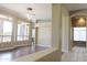 Bright, open-concept living room with wood floors and plenty of natural light at 13487 E Gold Dust Ave, Scottsdale, AZ 85259