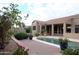 Backyard pool surrounded by landscaping, mature plants and covered patio at 13487 E Gold Dust Ave, Scottsdale, AZ 85259