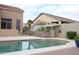 Backyard pool with privacy wall, flowering plants, shed and outdoor covered structure at 13487 E Gold Dust Ave, Scottsdale, AZ 85259