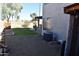 Well-maintained backyard with gravel ground cover, offering a serene and low-maintenance outdoor space at 1353 S Western Skies Dr, Gilbert, AZ 85296