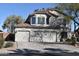 Charming two-story home featuring a spacious three-car garage and well-maintained landscaping at 1353 S Western Skies Dr, Gilbert, AZ 85296