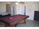 Spacious game room with pool table and neutral walls makes for a great entertainment area at 1353 S Western Skies Dr, Gilbert, AZ 85296