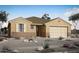 Charming single-story home featuring desert landscaping and a two-car garage at 14750 W El Cortez Pl, Surprise, AZ 85387