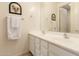 Clean bathroom featuring a double sink vanity, a mirror, and neutral decor at 1548 W Windhaven Ave, Gilbert, AZ 85233