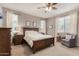 Spacious main bedroom with neutral walls, a ceiling fan, and plenty of natural light at 1548 W Windhaven Ave, Gilbert, AZ 85233