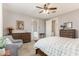 Bright main bedroom with an adjacent seating area and neutral walls at 1548 W Windhaven Ave, Gilbert, AZ 85233