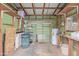 Storage area with shelving, water heater, and open wood framework with green siding at 17200 W Bell Rd # 2125, Surprise, AZ 85374