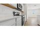 Beautiful kitchen featuring stainless steel appliances and white quartz countertops, providing ample space for meal preparation at 18345 W Gray Fox Trl, Wittmann, AZ 85361