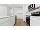 Well-appointed kitchen showcasing stainless steel appliances, sleek countertops, and plenty of cabinet space at 18345 W Gray Fox Trl, Wittmann, AZ 85361