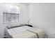 Cozy bedroom with a patterned bedspread and a window at 1943 E Hayden Ln # 103, Tempe, AZ 85281