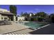 Community pool with chairs and a covered picnic area at 1943 E Hayden Ln # 103, Tempe, AZ 85281