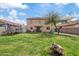 Expansive backyard view showcasing a well-maintained lawn, two story home, and entertainment area at 1978 E Connemara Dr, San Tan Valley, AZ 85140