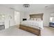 Spacious main bedroom with a large bed, bench, and carpet flooring at 1978 E Connemara Dr, San Tan Valley, AZ 85140