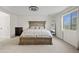 Well-lit main bedroom with a large bed, carpet flooring, and a window at 1978 E Connemara Dr, San Tan Valley, AZ 85140