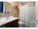 A well-maintained bathroom with a vanity, a bathtub, and a shower combo at 21854 N 263Rd Dr, Buckeye, AZ 85396