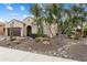 Attractive single-story home with desert landscaping, mature trees, and inviting curb appeal at 21854 N 263Rd Dr, Buckeye, AZ 85396