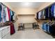 Organized walk-in closet with ample storage space and a center island with seating at 21854 N 263Rd Dr, Buckeye, AZ 85396