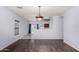 Open-concept dining room featuring modern flooring and neutral decor at 219 E Valley View Dr, Phoenix, AZ 85042