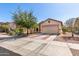 Single-story home featuring a two-car garage, desert landscaping, and a brick-lined driveway at 219 E Valley View Dr, Phoenix, AZ 85042