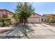 Charming single-story home with a two-car garage and well-manicured desert landscaping at 219 E Valley View Dr, Phoenix, AZ 85042