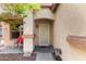 Covered front porch area featuring a metal security door and a colorful outdoor chair at 219 E Valley View Dr, Phoenix, AZ 85042