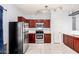 Kitchen boasting stainless steel appliances and ample cabinet space at 219 E Valley View Dr, Phoenix, AZ 85042